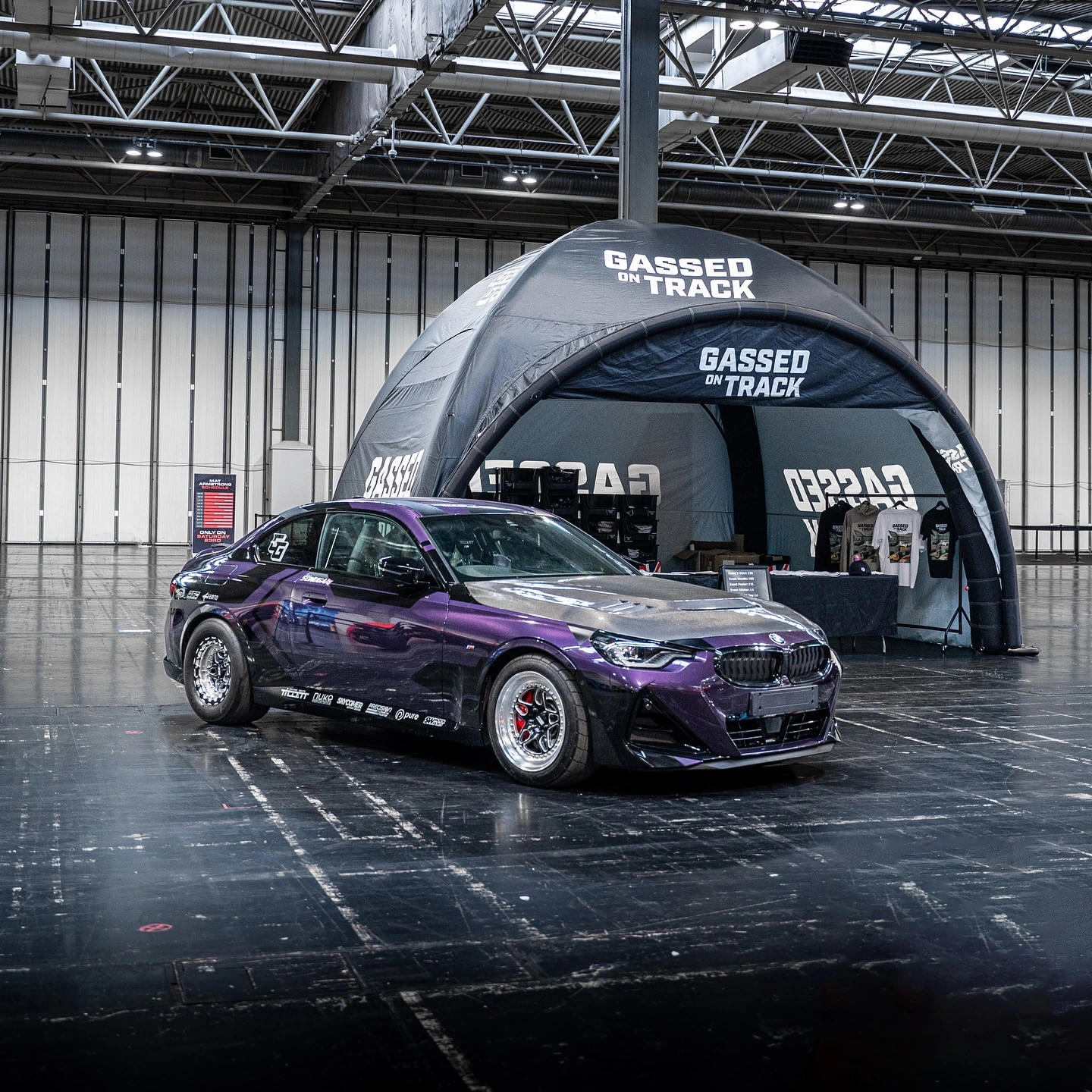 Gassed On Track tent with modified purple BMW